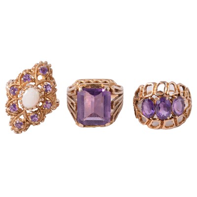 Lot 115 - Three 9 carat gold amethyst dress rings.