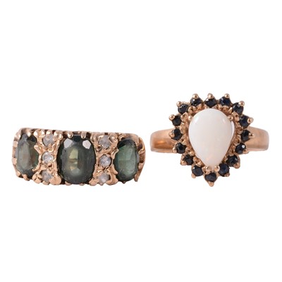 Lot 57 - An opal and sapphire ring, and another gemset ring.