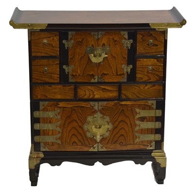 Lot 534 - Japanese elm and ebonised tansu