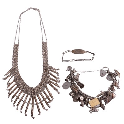 Lot 1257 - A white metal necklace, silver charm bracelet with charms, identity bracelet.