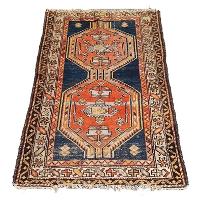 Lot 557 - Three antique wool rugs, all worn