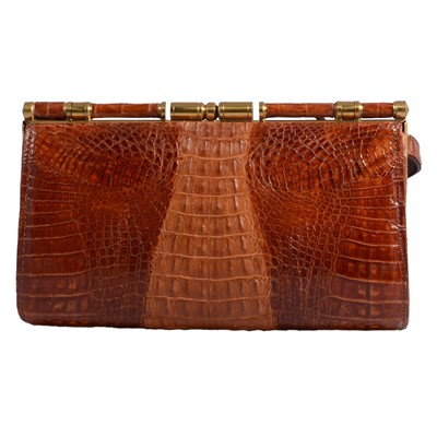 Lot 1177 - A vintage crocodile handbag.