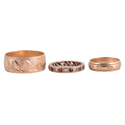 Lot 182 - Two 9 carat yellow gold wedding bands, and a gemset full eternity ring.