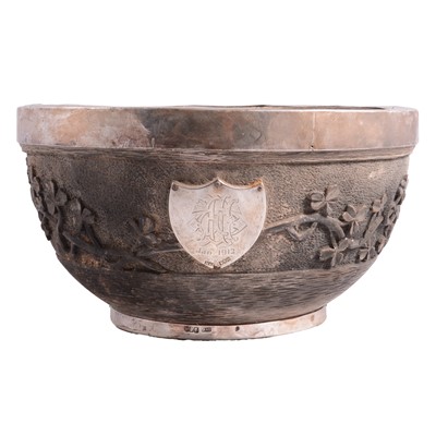 Lot 363 - An Irish carved wooden bowl with silver rim.