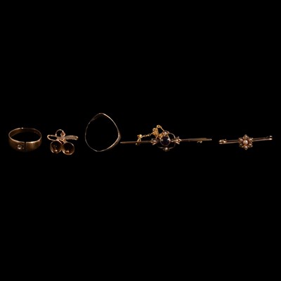 Lot 1126 - Two gold rings, two gemset brooches, and a gold bells and bow charm.