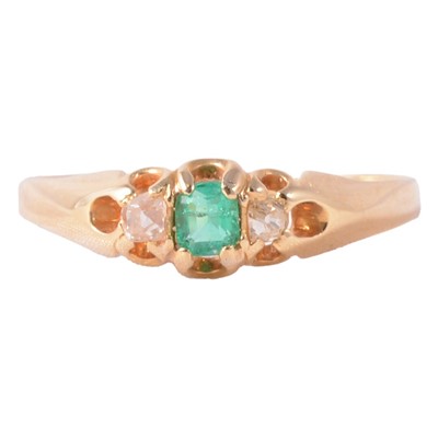 Lot 4 - An emerald and diamond ring.