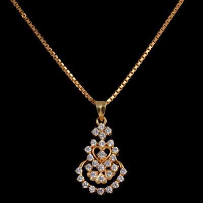 Lot 403 - A diamond set pendant and chain.