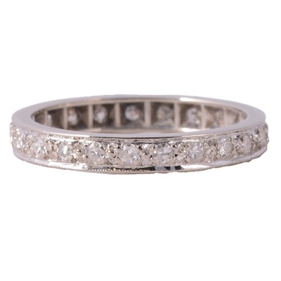 Lot 106 - A diamond full eternity ring.