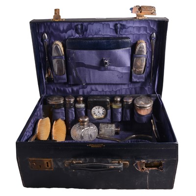 Lot 339 - George V leather travelling case, silver mounted fitments