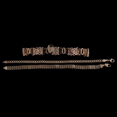 Lot 312 - Three 9 carat yellow gold bracelets.