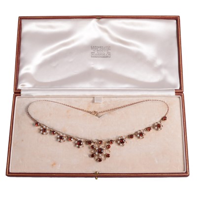Lot 357 - A vintage garnet and pearl necklace in a Garrard box.