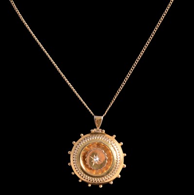 Lot 242 - A diamond target brooch pendant on a gold-plated chain.