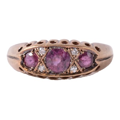 Lot 29 - A pink stone and diamond ring.