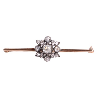 Lot 239 - A diamond bar brooch.