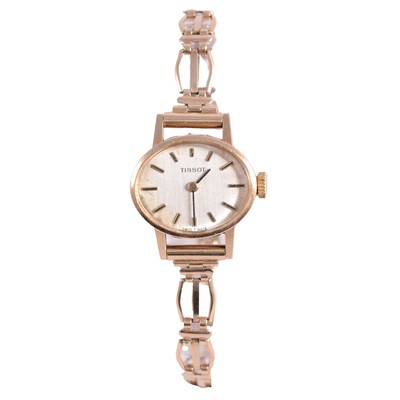 Lot 476 - Tissot – a lady’s 9 carat yellow gold manual wind bracelet wristwatch.