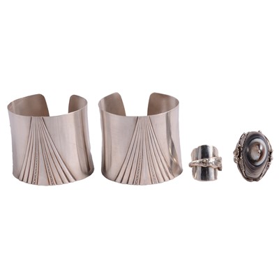 Lot 1236 - Two wide modern silver cuff bangles in the Art Deco style, agate ring and a spoon ring.