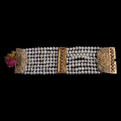 Lot 1149 - An Afghan multi strand pearl cuff bracelet and pair of black earrings.