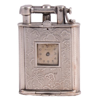 Lot 1203 - A white metal lift arm watch lighter.