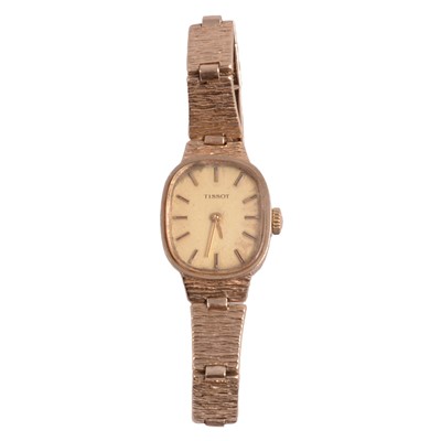 Lot 477 - Tissot - a lady's 9 carat yellow gold manual wind bracelet wristwatch.