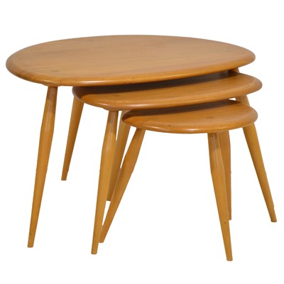 Lot 374 - Nest of three Ercol light elm and beech pebble coffee tables