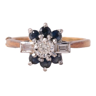Lot 24 - A sapphire and diamond ring.