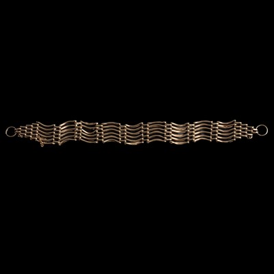 Lot 311 - A 9 carat yellow gold six bar gate link bracelet.