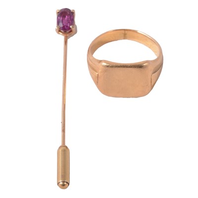 Lot 153 - A yellow metal signet ring, and a pink stone stick pin.