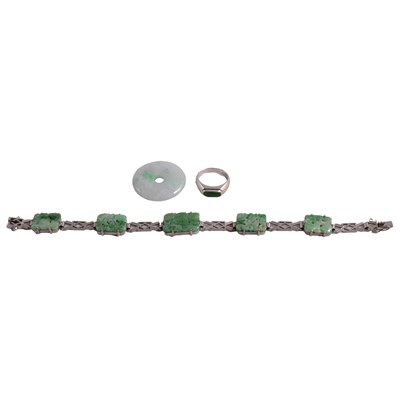 Lot 1153A - Jade and white metal bracelet, Imperial jade ring, and jade disc.