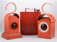 Lot 1051 - Two red painted road lamps and a 1 gallon red '...