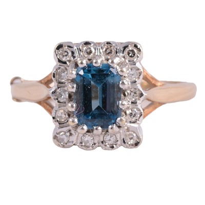 Lot 65 - A heat-treated blue topaz and diamond cluster ring.