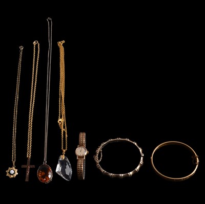 Lot 1209 - A lady's gold wristwatch, silver and rolled gold half-hinged bangles, and pendants on chains.