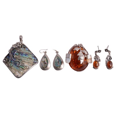 Lot 1242 - Baltic amber and abalone pendants and earrings.