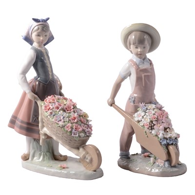 Lot 55 - Lladro, two figures - one Girl, one Boy with floral wheelbarrows