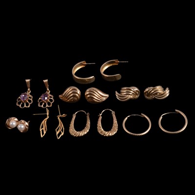 Lot 454 - A collection of gold and yellow metal earrings for pierced ears.