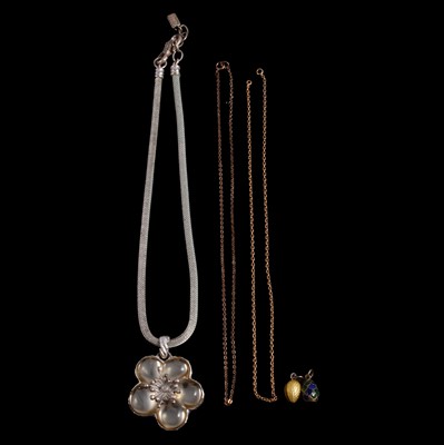 Lot 1276 - Two Russian egg pendants, a yellow metal chain, a gilt metal chain, and a Kenzo pendant on a chain.