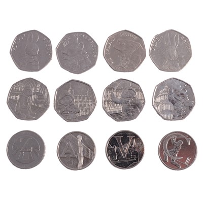 Lot 197 - Seventeen Beatrix Potter and Paddington Bear 50p coins, and four Alphabet 10p coins.