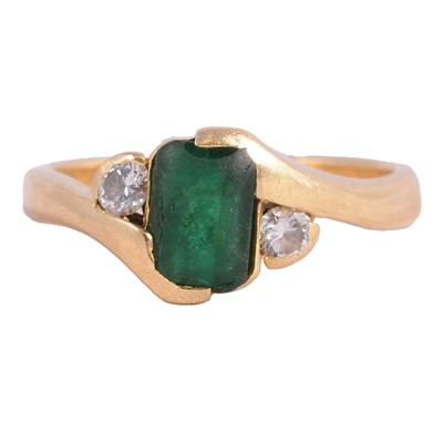 Lot 12 - An emerald and diamond ring.