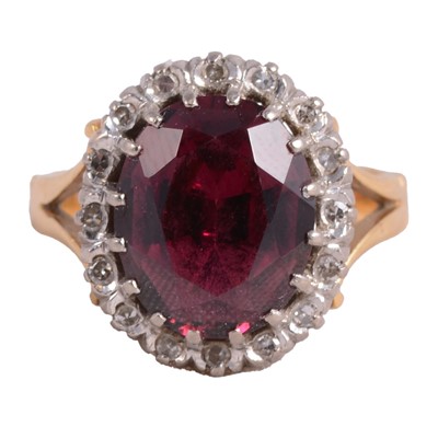 Lot 26 - A garnet and diamond ring.