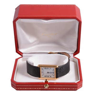 Lot 1085 - Cartier – a lady’s Tank yellow metal quartz wristwatch.
