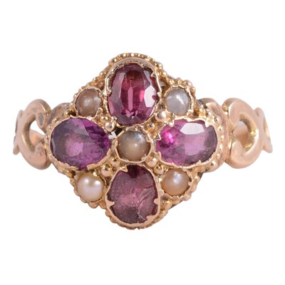 Lot 16 - An amethyst and seed pearl ring.