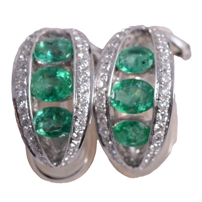 Lot 176 - A pair of emerald and diamond earclips.