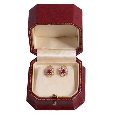 Lot 173 - A pair of ruby and diamond earclips.