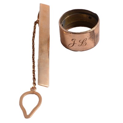 Lot 478 - A yellow metal tieclip, and a yellow metal band from an umbrella.