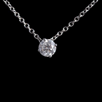 Lot 391 - A diamond solitaire pendant.