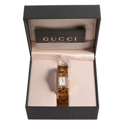 Lot 1111 - Gucci - a lady's gold-plated quartz bracelet wristwatch.