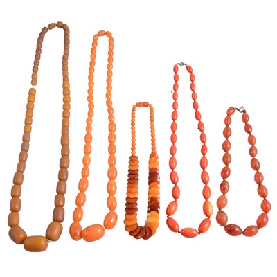 Lot 1310 - A collection of amber-coloured, agate, and glass bead necklaces, and loose amber-coloured beads.