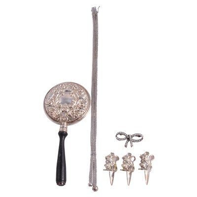 Lot 282 - A bow brooch, stamped 925, a white metal necklace, a silver backed handbag mirror, and three novelty cheese skewers