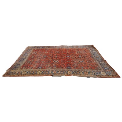Lot 456 - Large Sarouk carpet, cut and worn