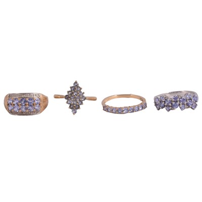 Lot 70 - Four dress rings set with tanzanite.