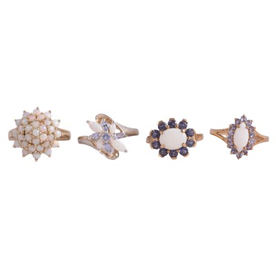 Lot 40 - Four opal and tanzanite dress rings.